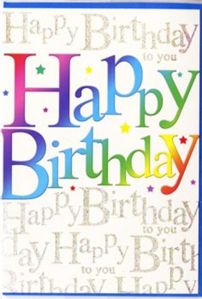 A joyful birthday card is pictured, its front design glowing with the same colourful energy you might see at an Oxford street festival near Broad Street. The central message, Happy Birthday, is displayed in large, rounded block letters that curve slightly, giving them a friendly, approachable feel. Each letter is painted in its own bright hue, creating a seamless rainbow gradation that flows from rich crimson and fuchsia into tangerine, lemon yellow, fresh leaf green, sea blue, indigo, and plum. The tonal transitions are gentle, like watercolours washing into one another, giving the words a soft yet vivid presence. These multicoloured letters sit against a pale backdrop that is densely overlaid with a repeating gold script, the phrase Happy Birthday to you written again and again in fine, looping handwriting. The metallic gold ink picks up the light in a quiet, twinkling way, reminiscent of sun hitting the spires and stone of Oxford's historic colleges after a shower. The script lies behind the rainbow text, never competing with it, but adding depth and a sense of layered well-wishes, as if many voices were all singing along. The card's surface appears smooth and slightly glossy, inviting touch; you can almost imagine running a hand over the front while deciding what personal message to add inside. Flecks of subtle sparkle and tiny star-like details float around the letters, echoing the festive feeling of confetti scattered over a birthday table in a Summertown home. The overall impression is one of cheerful sophistication, a card that would pair beautifully with a bright bouquet from a trusted Oxford florist, delivered across Headington, Cowley, or Jericho to make a birthday feel truly special.