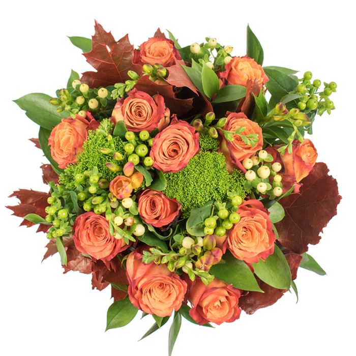 A top-view photograph against stark white presents a lavish, autumnal bouquet that balances colour, weight, and texture with assured floral craftsmanship. At the heart of the arrangement are abundant, fully opened roses in a chorus of peach to deep orange, each bloom showing a gentle gradation into reddish-rust at the outer petals, reminiscent of maple leaves turning in late October. Scattered among these roses are small clusters of Hypericum berries-some a vivid lime that lifts the palette, others a pale cream that softens it-creating tiny focal points that catch the eye. Nestled between the larger blooms, tufts of Green Trick dianthus resemble verdant moss or miniature green cushions, their dense, almost velour surfaces introducing an unexpected tactile counterpoint. The bouquet is grounded by an underlayer of glossy green leaves and accented with larger, lobed foliage in rich burgundy and rusty brown, which read like dried oak leaves and reinforce the harvest theme. The arrangement's circular, tightly packed form is highlighted by soft, diffuse lighting that accentuates petal texture and the berries' subtle sheen, casting gentle shadows that articulate depth without harsh contrast. This piece reads as both celebratory and contemplative-ideal for a Thanksgiving-style table, an autumn birthday, or a heartfelt seasonal gift delivered across Oxford and nearby neighbourhoods. The overall impression is one of warmth and abundance: a tactile, fragrant composition that invites touch and lingers in memory long after the flowers are set down.