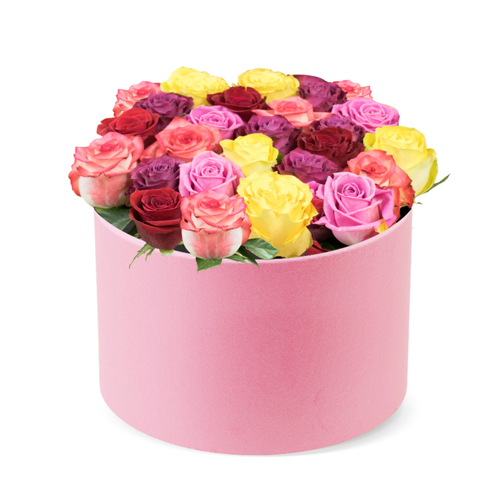 Luxuriant and meticulously arranged, this stunning floral display sits in a soft pink round hat box, a perfect harmony of texture and pastel tone. The velvet-like exterior of the container absorbs the light, giving the box a quiet opulence that invites a closer look. Against a pristine white backdrop, dozens of tightly formed roses spill from the rim, creating a dense dome that speaks of expert design. The bouquet carries a refined sense of ceremony, as if prepared in a boutique studio on Oxford's High Street, ready to mark a moment with style.

The colour story is majestic: crimson red anchors the arrangement with regal depth, complemented by magenta, rich burgundy, and a spectrum of pinks from soft blush to vibrant fuchsia, with hints of cream. Bi-colour petals weave through the bouquet, adding warmth and movement. Leaves remain a delicate fringe beneath the blooms, allowing the petals to dominate and the perfume to linger in the air. Each bloom looks fresh, with smooth petals that hold their form, evidence of careful handling and premium sourcing.

As a gift, it embodies celebration, romance, and thoughtful luxury. It's ideal for Valentine's Day, anniversaries, or a heartfelt surprise delivered by a trusted Oxford florist across the city-from the university campuses to Summertown and Headington. This elegant rose box promises more than beauty: it offers a tangible moment of elegance, a signature of craftsmanship that harmonises with home décor and special occasions, and an invitation to pause and savour the scent of a well-tended garden.