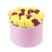 A vibrant and elegant floral arrangement is presented in a modern cylindrical pastel pink gift box with a curved scooped front opening, set against a pristine white background in the Flowers Oxford studio near the heart of Oxford. The box wears a soft matte finish, the design daring yet refined, and the cluster inside is a lush mass of blooms. The bouquet is dominated by cheerful yellow roses, their petals unfurling to form a rounded silhouette that exudes sunshine and warmth. Carefully placed among them are smaller deep burgundy or purple roses, adding depth, luxury, and a sense of drama to the composition. The combination of pale pink, sunny yellow, and rich purple creates a contemporary, jewel-toned palette that feels both celebratory and chic. The flowers are packed tightly, filling the front opening and rising slightly above the rim to convey abundance. A touch of green foliage is visible, but kept to a minimum to let the colors sing. This stylish arrangement is ideal for modern gifting, event decor, or a thoughtful home surprise, and is available for same day delivery across Oxford from the Jericho to Summertown neighbourhoods. It embodies a quiet, joyful celebration and the careful craftsmanship of a local florist who knows the city well, making it a thoughtful choice for birthdays, anniversaries, or a gesture of friendship.