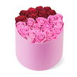 From Flowers Oxford, this luxurious and meticulously arranged floral display sits centered in a soft pink velvet cylindrical hatbox, the crisp white backdrop giving it gallery-quality presence. Dozens of fully opened roses fill the box to the brim, their petals catching light with a satin-like sheen. The blossoms are arranged in two striking colour blocks: at the top, roughly a dozen deep crimson red roses curve in a crescent that hints at a heart or a deliberate division; below, the broader lower half bursts with bright fuchsia pink roses, a lively counterpoint that glows against the pale velvet.
Each bloom wears tightly layered petals, suggesting premium fresh-cut stock or long-lasting preserved roses. The overall effect is elegant romance, ideal for Valentine's Day, anniversaries, or a sophisticated home display that elevates any dining room or foyer. In Oxford, we love crafting gifts that feel intimate yet luxurious, whether you are sending from Jericho, Summertown, or the more historic lanes near the University Parks. We offer careful, same-day delivery across the city, ensuring this centerpiece can arrive promptly for a surprise on a doorstep near the Oxford Castle Quarter or the train station. The product-shot presentation highlights the quality of the roses and the craftsmanship of the box, inviting a viewer to imagine the soft sound of petals brushing together and the gentle scent of a fresh, premium bouquet. It's more than a gift box; it's a promise of celebration, refinement, and a touch of romance that makes a home feel suddenly more special.